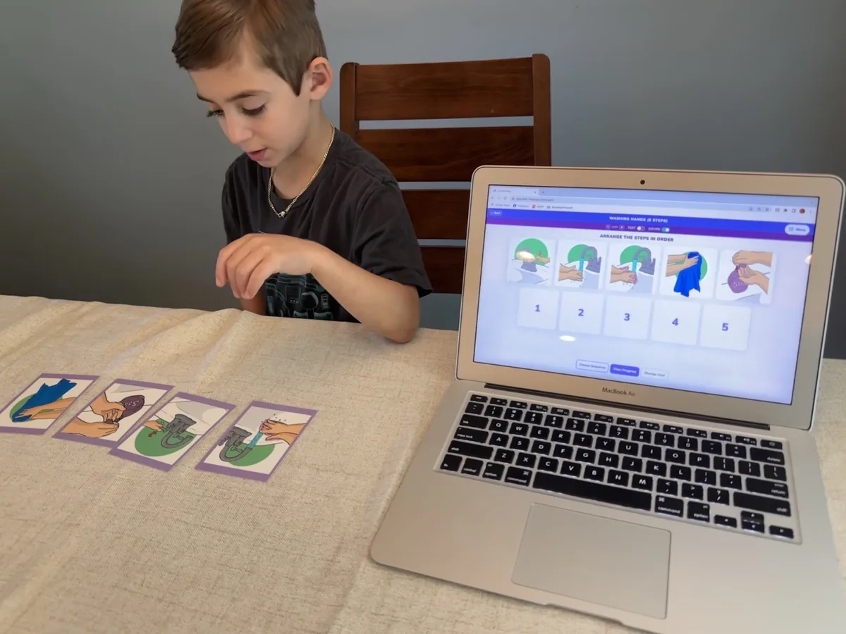 StepByStep washing hands cards next to the digital app