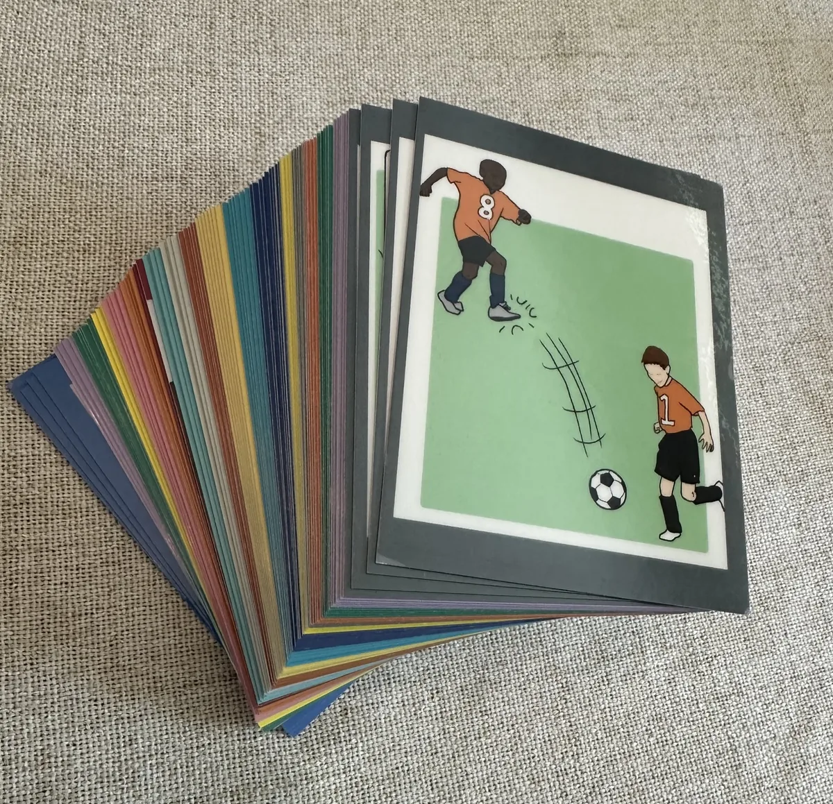 Fan of colorful laminated StepByStep sequence cards